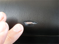 applying leather glue to scuff