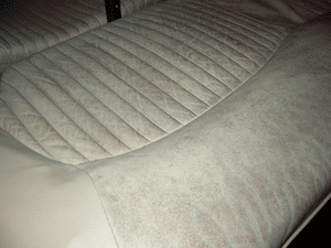 worn cream car seat